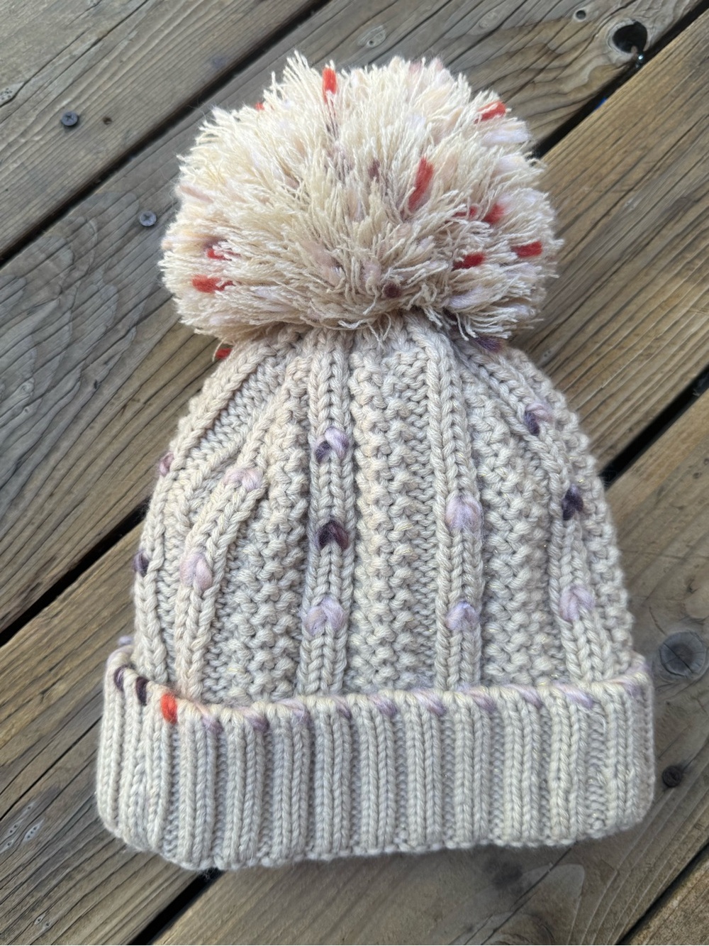 Cozy Cream Knit Pom Beanie with Subtle Color Accents Cara New York